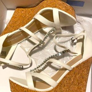 Women’s white heeled wedges. Brand new.